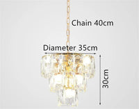 Round gold steel chandelier with crystal and interior LED lighting