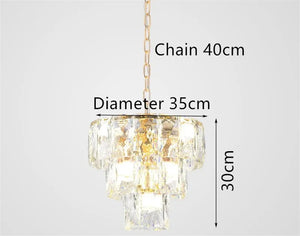 Round gold steel chandelier with crystal and interior LED lighting