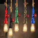 Vintage steampunk pendant light in industrial pipe and hemp rope