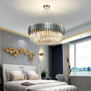 Elegant and modern art deco chandelier in stainless steel and crystal