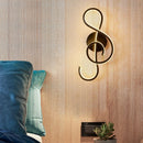 LED wall light in music clef shape