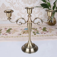 Retro metal three-arm candle holder for events and decorations