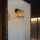 Wall light with openwork rattan shade taora