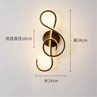 LED wall light in music clef shape