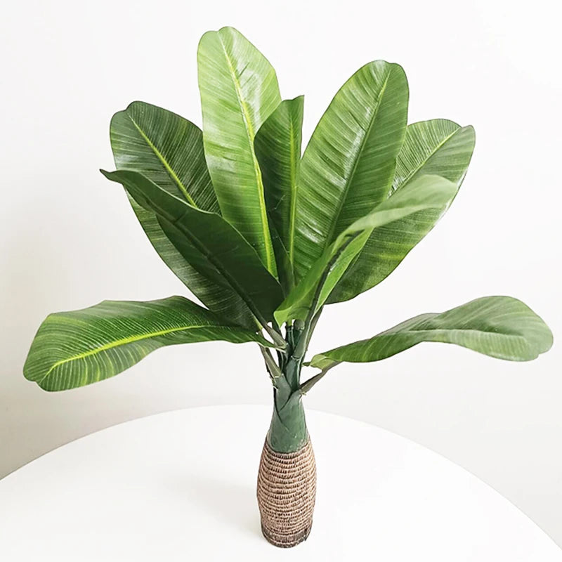 Artificial monstera palm tree in pot for indoor decor