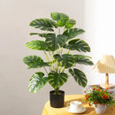 Artificial tropical tree with large decorative monstera leaves