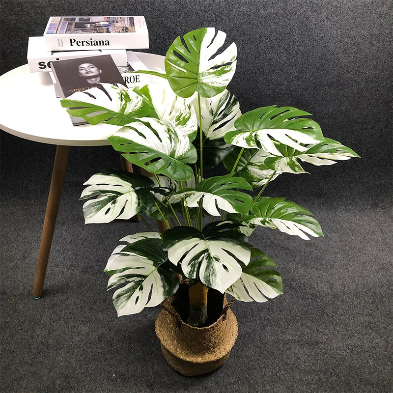 Large artificial plants with decorative palm leaves