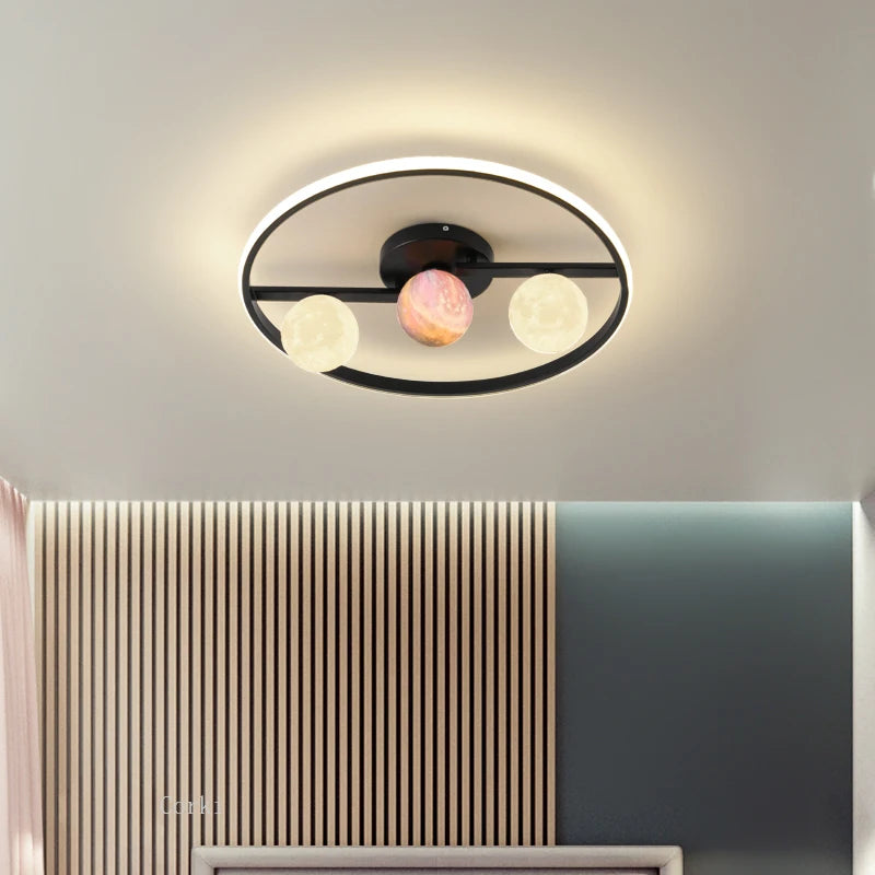 designer ceiling light in black and gold metal with white ball for modern interiors