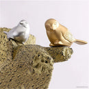 Chinese style wall light with resin birds and rattan shade