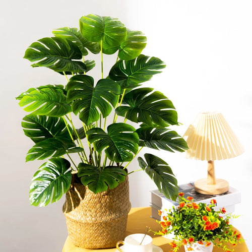 Artificial tropical tree with large decorative monstera leaves