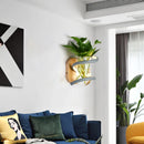 Nordic wooden wall light with green plant for a warm atmosphere