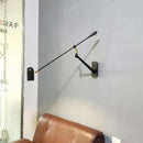 Retractable LED wall light with folding arm