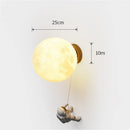 Modern astronaut wall light for children's bedside with star and moon decor