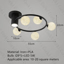 designer ceiling light in black and gold metal with white ball for modern interiors