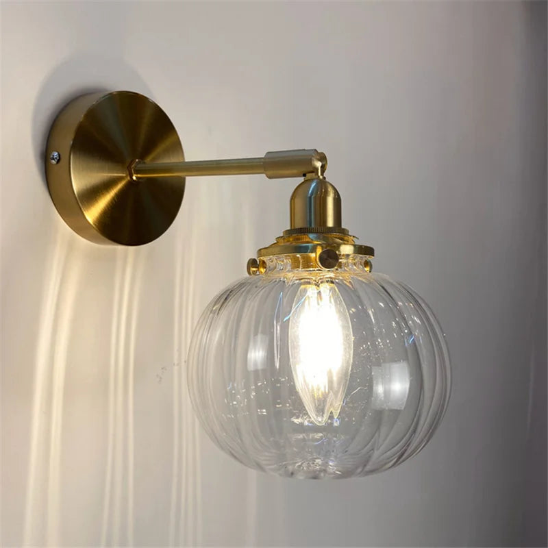 Retro brass and glass wall light with elegant design for interiors