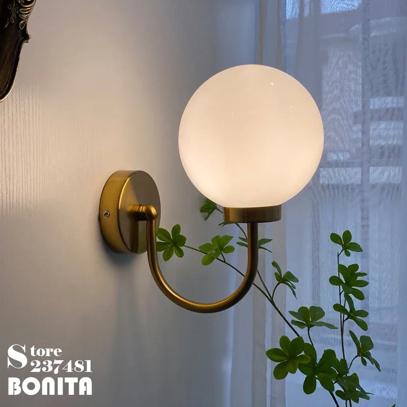 Elegant and modern chrome and milky glass wall light