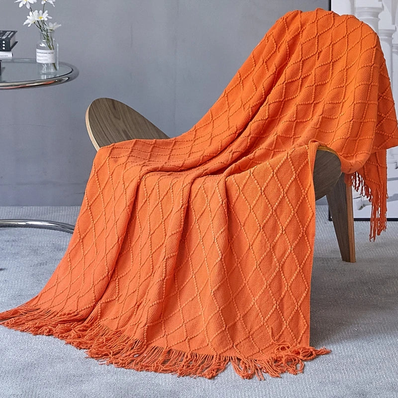 Lightweight knitted throw with pom-poms cosy style for living room