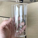 Transparent glass cup-shaped candle holders for festive home decoration