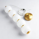 Designer LED pendant light with glossy gold glass ball