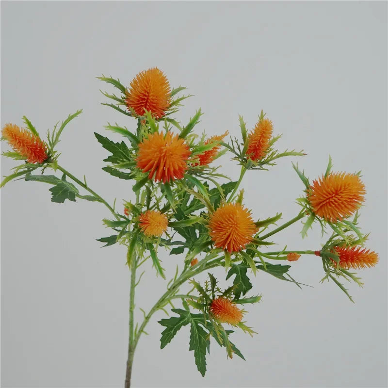 Decorative artificial sea holly flowers in pink and violet