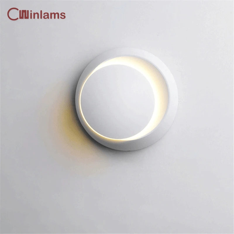 Modern rotating round LED wall light for interiors