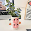 abstract ceramic vase with human face floral decoration