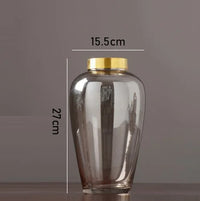 modern glass vase with metal base for floral decoration
