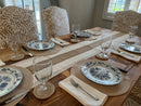 Beige boho table runner with geometric patterns and tassels