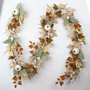 Autumn garland with pumpkins, berries and maple leaves