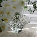 glass vase with decorative stones for flowers and terrarium