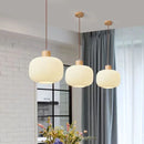 Glass pendant light with Nordic wood detail