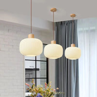Glass pendant light with Nordic wood detail