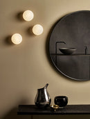 Minimalist glass wall light for modern interiors