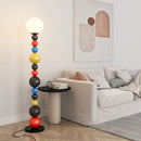 Modern floor lamp with colourful beads and glass shade