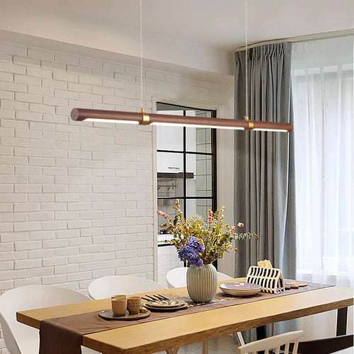 Minimalist wood and metal pendant light with adjustable height for versatile spaces