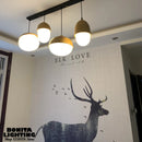 Modern glass and wood pendant light with mushroom design