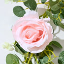 Artificial pink flowers and green plants for indoor decoration