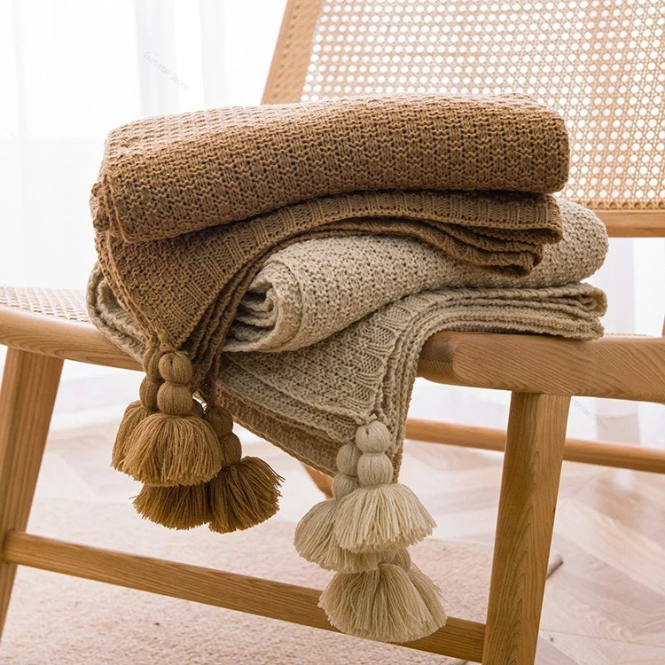 Chunky waffle knit throw with pom poms nordic style