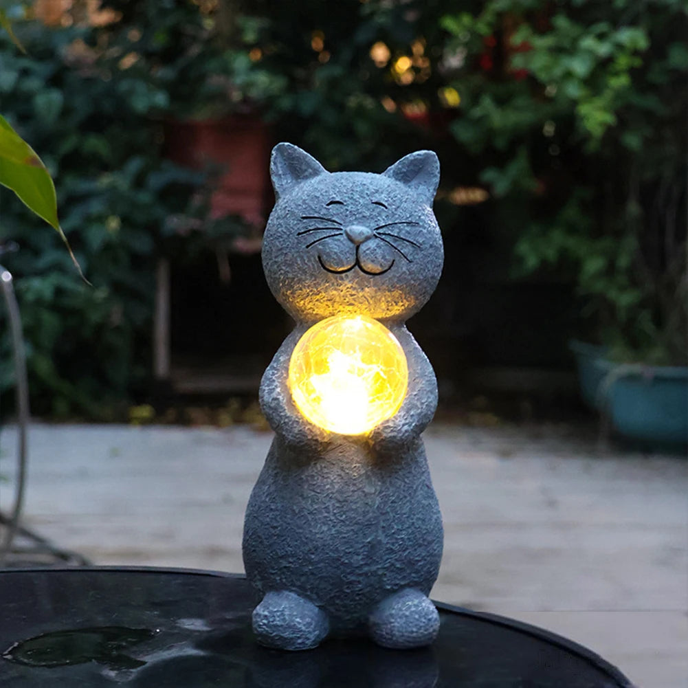Garden cat statue with decorative solar lantern for outdoor use