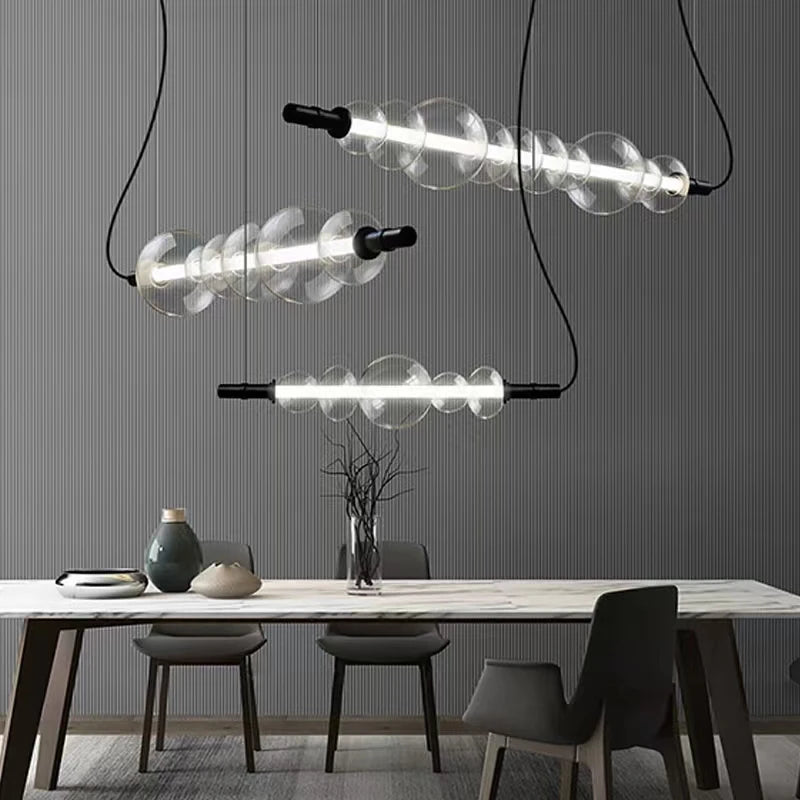 Modern glass bar counter with minimalist pendant lighting