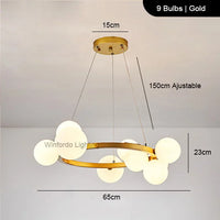 Gold round LED chandelier with glass globes