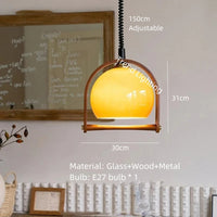 Modern glass and wood pendant light with adjustable height for indoor use