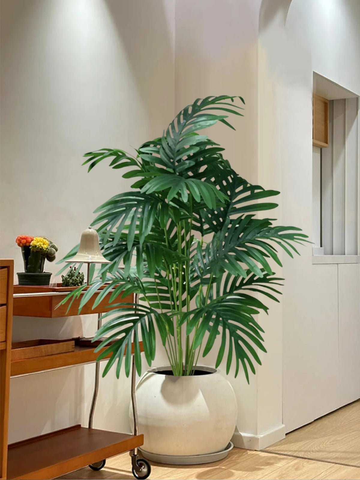Artificial palm tree with tropical leaves for interior decoration