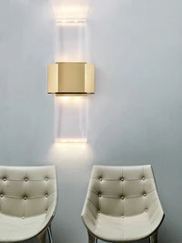 Minimalist stainless steel and crystal wall light