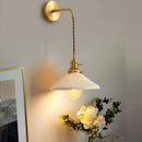 Modern gold ceramic wall light with adjustable cord and LED