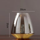 modern glass vase with metal base for floral decoration