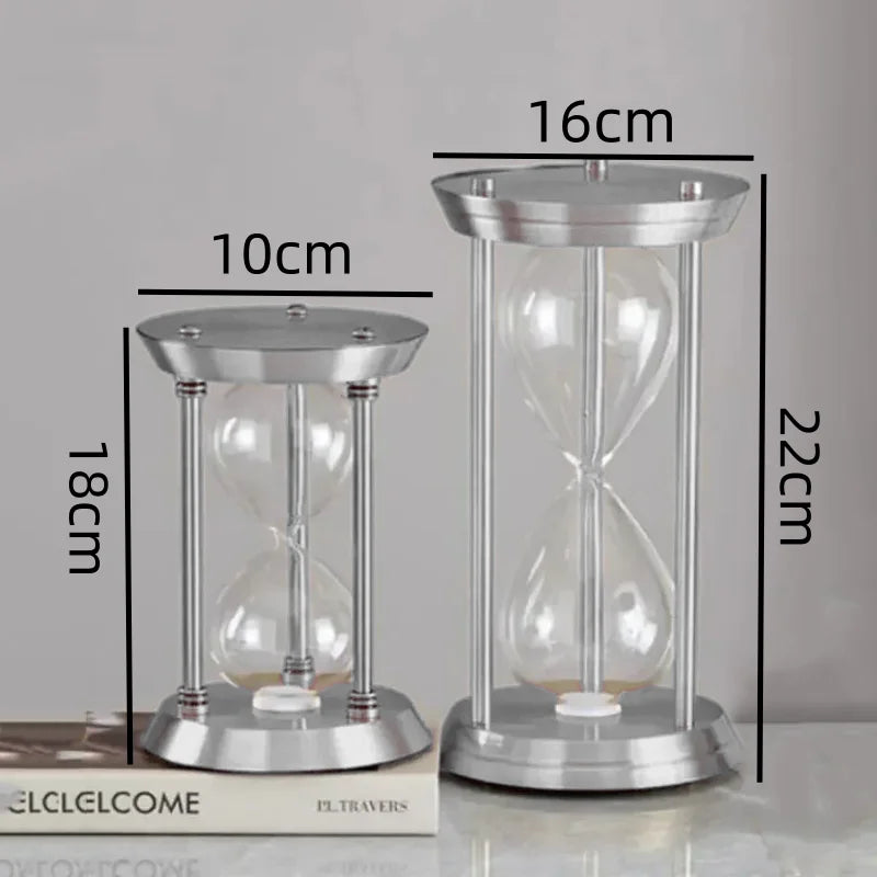 empty decorative metal hourglass bottle with colored sand