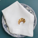 Embroidered linen napkin with croissant motif, customisable