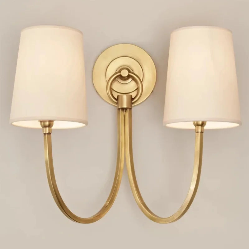 Brass wall light with flexible lampshade