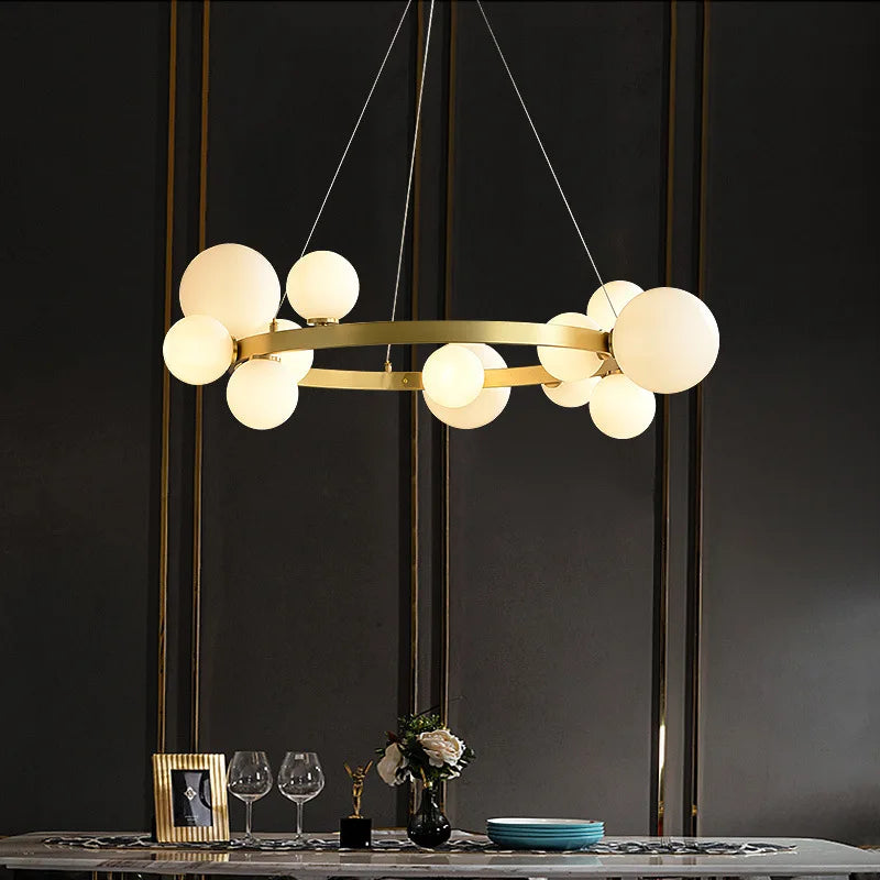Gold round LED chandelier with glass globes